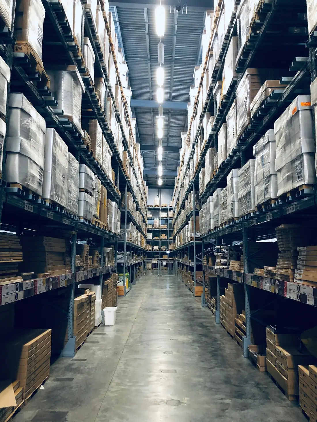 Warehouse aisle with racking and packed goods